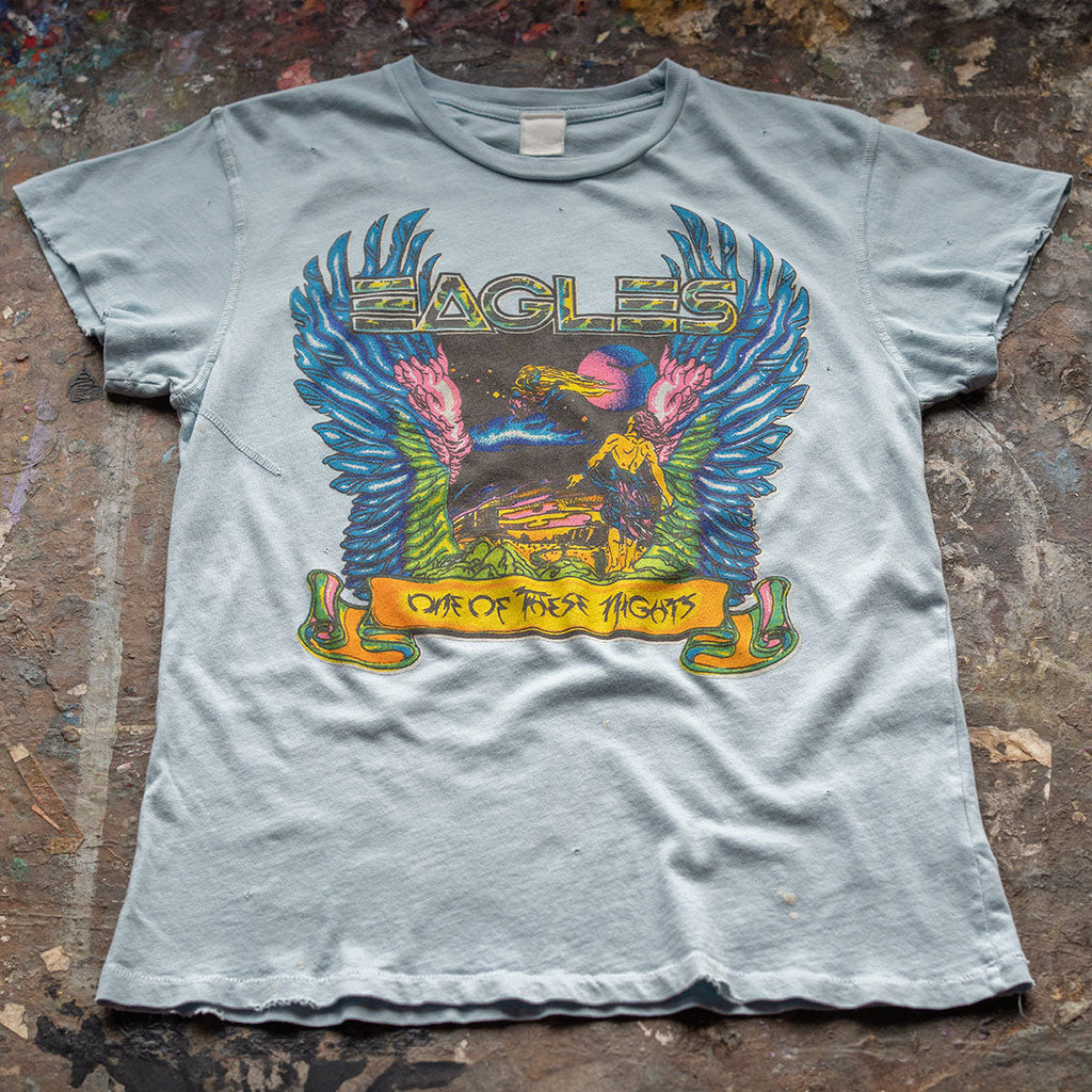 tee-light blue-eagles logo one of these nights with eagle wings and a man