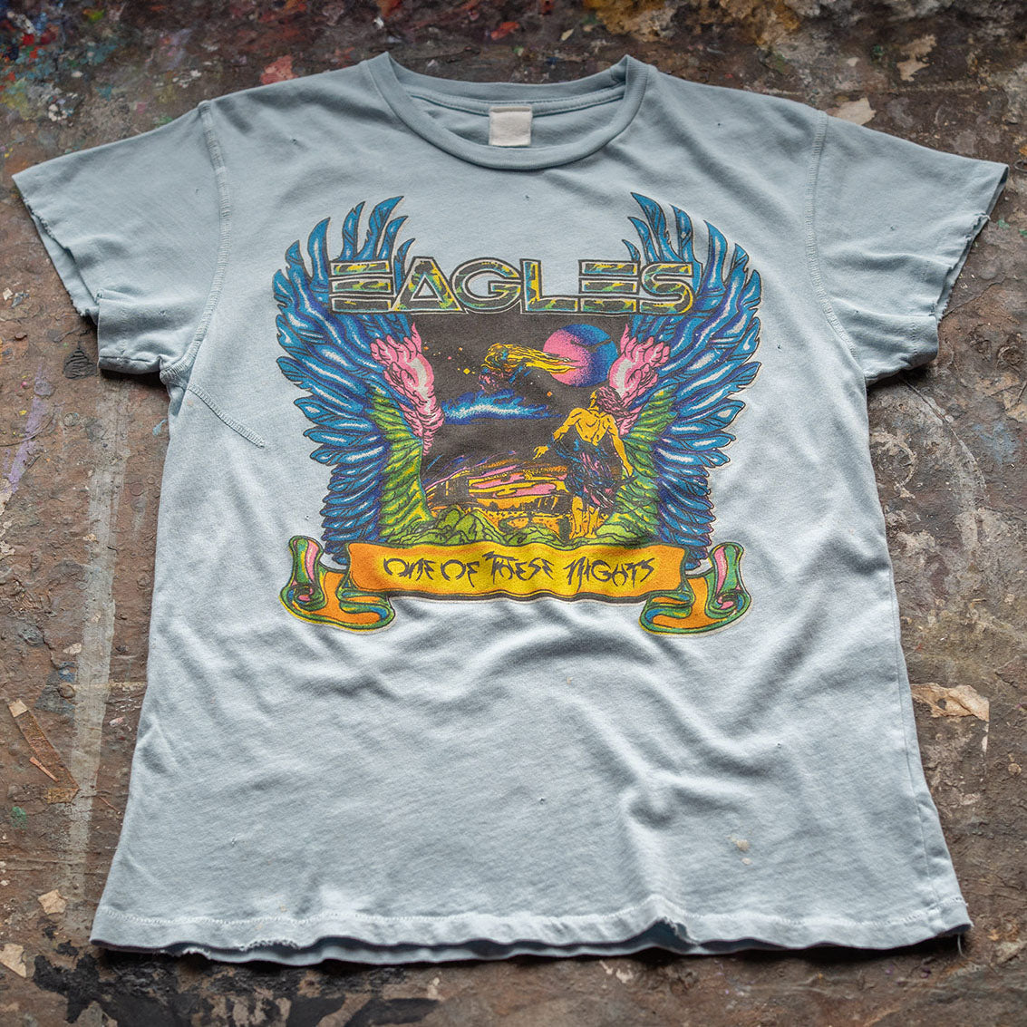 tee-light blue-eagles logo one of these nights with eagle wings and a man